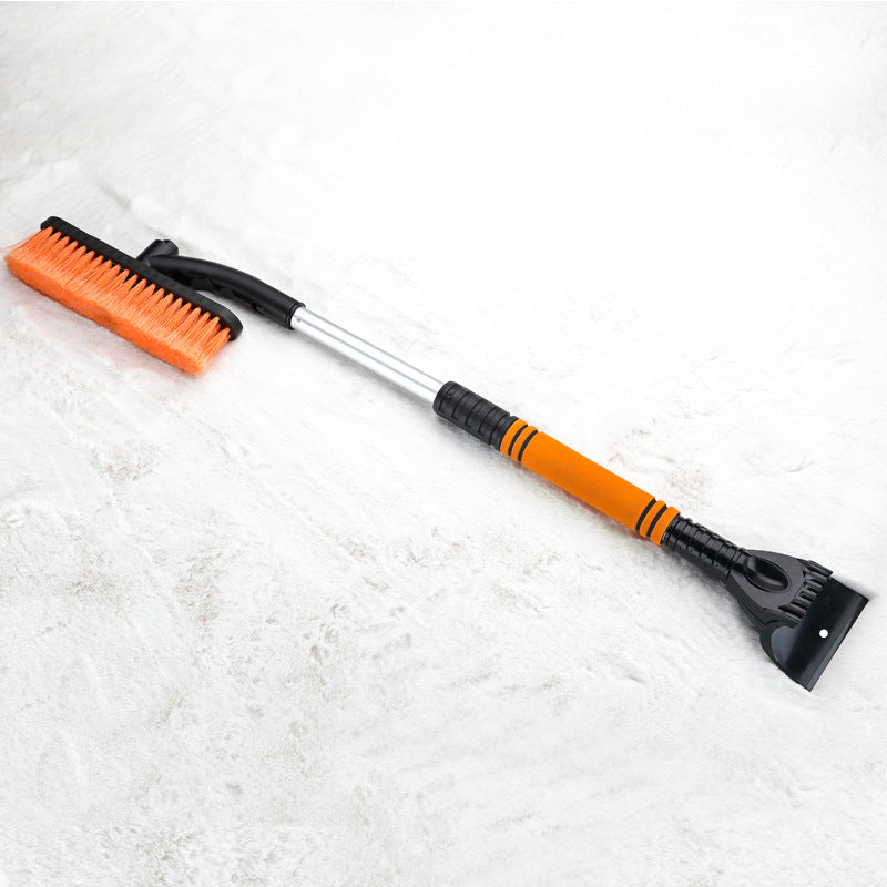 Orange extendable snow brush and ice scraper