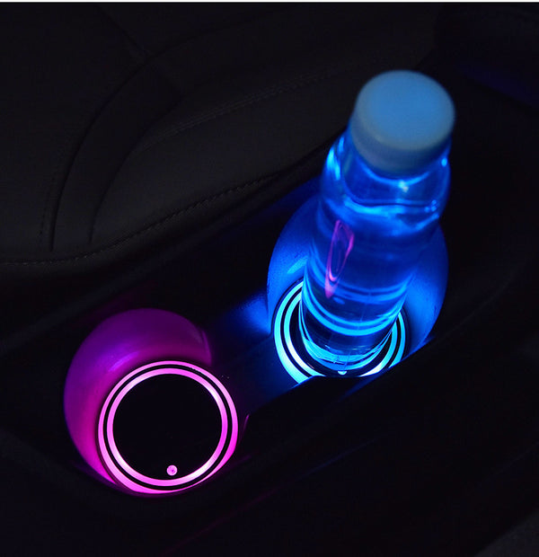 LED coaster lit under a bottle