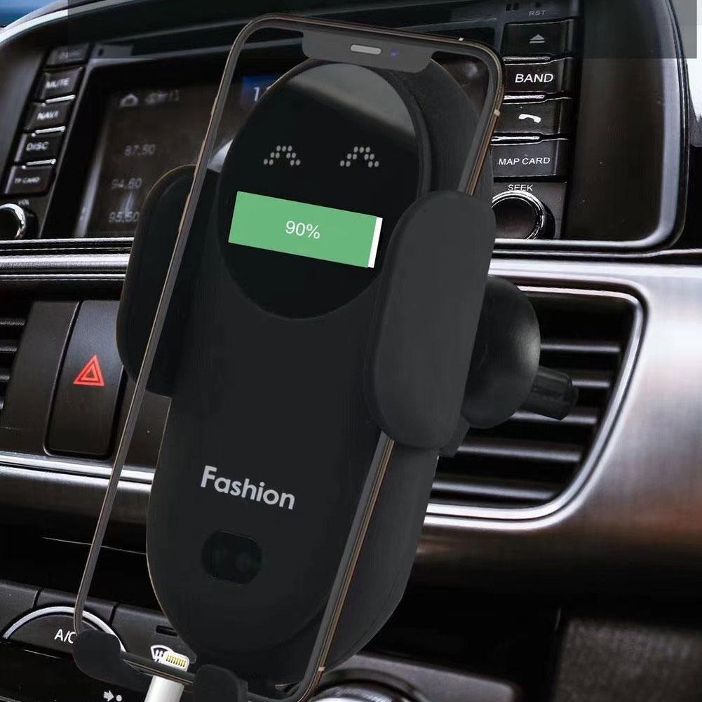 Black wireless charging phone mount in use