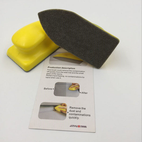 Yellow nano cleaning brush showing the sponge underside and grip